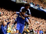 Diego Costa of Chelsea is congratiulated by teammate Willian of Chelsea after scoring his team's second goal during the Barclays Premier League match between Chelsea and Aston Villa at Stamford Bridge on September 27, 2014