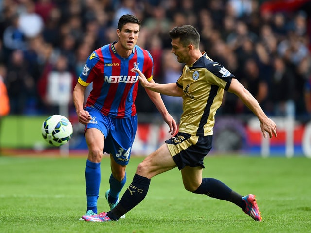 Martin Kelly of Crystal Palace battles for the ball with David Nugent of Leicester City during the Barclays Premier League match between Crystal Palace and Leicester City at Selhurst Park on September 27, 2014
