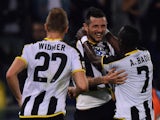 Cyril Thereau (C) of Udinese celebrates with team mates after scoring the opening goal during the Serie A match against SS Lazio on September 25, 2014
