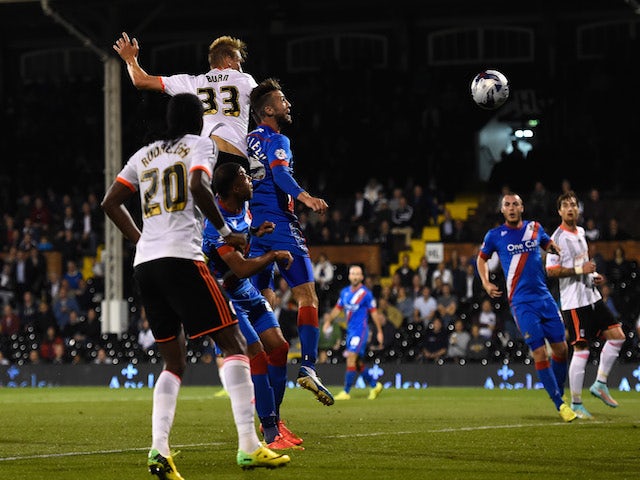 Dan Burn of Fulham scores his team's second goal during the Capital One Cup Third Round match between Fulham and Doncaster Rovers at Craven Cottage on September 23, 2014