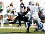 Eric Decker #87 of the New York Jets scores a touchdown in the third quarter against the Detroit Lions defense on September 28, 2014