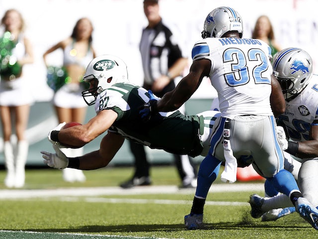 Eric Decker #87 of the New York Jets scores a touchdown in the third quarter against the Detroit Lions defense on September 28, 2014
