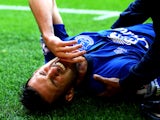 Kevin Mirallas of Everton pulls up with a hamstring injury during the Barclays Premier League match between Liverpool and Everton at Anfield on September 27, 2014