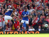 Phil Jagielka of Everton scores a late goal to level the scores at 1-1 during the Barclays Premier League match between Liverpool and Everton at Anfield on September 27, 2014