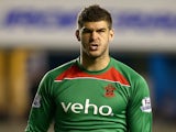 Southampton goalkeeper Fraser Forster looks on during the Capital One Cup Second Round match between Millwall and Southampton at The Den on August 26, 2014