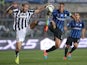 Juventus' defender Giorgio Chiellini fights for the ball with Atalanta's Argentinian forward German Gustavo Denis during the Italian Serie A football match Atalanta Vs Juventus on September 27, 2014