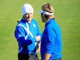 Graeme McDowell (L) talks to Victor Dubuisson of Europe on the 2nd green during the Afternoon Foursomes of the 2014 Ryder Cup on the PGA Centenary course at Gleneagles on September 26, 2014