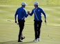 Justin Rose (R) of Europe celebrates his birdie with Henrik Stenson on the 4th hole during the Morning Fourballs of the 2014 Ryder Cup on the PGA Centenary course at Gleneagles on September 26, 2014