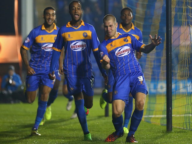 James Collins (R) of Shrewsbury Town celebrates scoring the opening goal during the Capital One Cup Third Round match against Norwich City on September 23, 2014