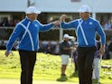 Jamie Donaldson (L) and Lee Westwood of Europe celebrate as they leave the 12th green during the Afternoon Foursomes of the 2014 Ryder Cup on the PGA Centenary Course at Gleneagles on September 26, 2014