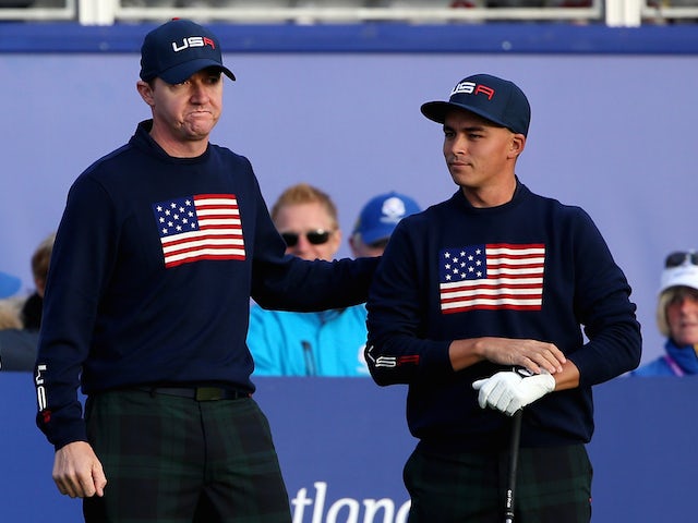 Jimmy Walker of the United States talks with partner Rickie Fowler before teeing off on the first hole during the Morning Fourballs of the 2014 Ryder Cup on the PGA Centenary course at Gleneagles on September 27, 2014