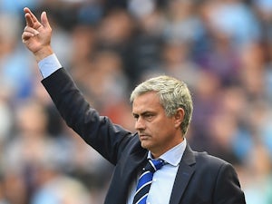 Jose Mourinho of Chelsea gives out instructions during the Barclays Premier League match between Manchester City and Chelsea at Etihad Stadium on September 21, 2014