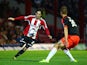 Jota attacks for Brentford during the Capital One Cup Second Round match between Brentford and Fulham at Griffin Park on August 26, 2014