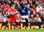Romelu Lukaku of Everton holds off the challenges from Alberto Moreno of Liverpool during the Barclays Premier League match between Liverpool and Everton at Anfield on September 27, 2014