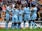 Sergio Aguero of Manchester City celebrates with team-mates after scoring the opening goal during the Barclays Premier League match between Hull City and Manchester City at KC Stadium on September 27, 2014