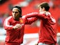 Radamel Falcao Garcia of Manchester United warms up with team-mate Paddy McNair before the Barclays Premier League match between Manchester United and West Ham United at Old Trafford on September 27, 2014