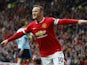 Manchester United's English striker Wayne Rooney celebrates scoring the opening goal during the English Premier League football match between Manchester United and West Ham United at Old Trafford in Manchester on September 27, 2014