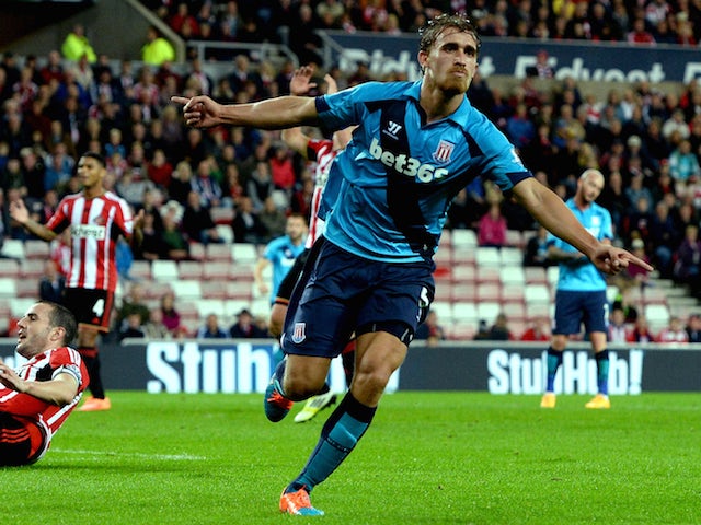 Marc Muniesa of Stoke City (R) celebrates after scoring their first goal during the Capital One Cup Third Round match against Sunderland on September 23, 2014