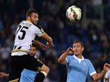 Lazio's German forward Miroslav Klose (R) fights for the ball with Udinese's French defender Thomas Heurtaux (L) during the Italian Serie A football match Lazio vs Udinese on September 25, 2014