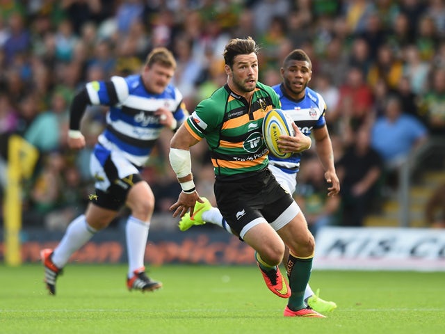 Ben Foden of Northampton Saints breaks with the ball during the Aviva Premiership match between Northampton Saints and Bath Rugby at Franklin's Gardens on September 27, 2014
