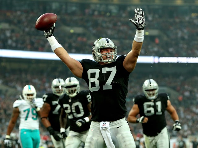 Brian Leonhardt #87 of the Oakland Raiders celebrates after after making a reception to score the game's opening touchdown during the NFL match between the Oakland Raiders and the Miami Dolphins at Wembley Stadium on September 28, 2014