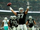 Brian Leonhardt #87 of the Oakland Raiders celebrates after after making a reception to score the game's opening touchdown during the NFL match between the Oakland Raiders and the Miami Dolphins at Wembley Stadium on September 28, 2014