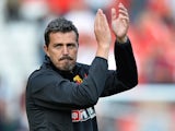 Oscar Garcia Manager of Watford claps the away support after the Sky Bet Championship match between Charlton Athletic and Watford at The Valley on September 13, 2014