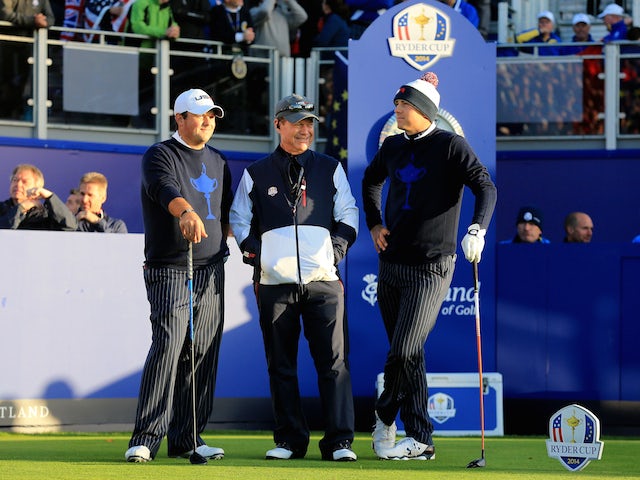 USA trio Patrick Reed, captain Tom Watson and Jordan Spieth look on from the 1st tee during the Morning Fourballs of the 2014 Ryder Cup on the PGA Centenary course at Gleneagles on September 26, 2014