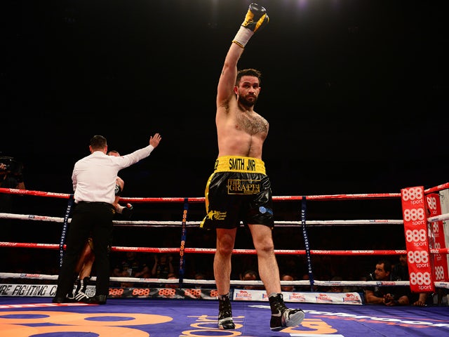 Paul Smith celebrates as the Referee stops his fight against David Sarabia during their Super Middleweight bout at the Motorpoint Arena on May 17, 2014