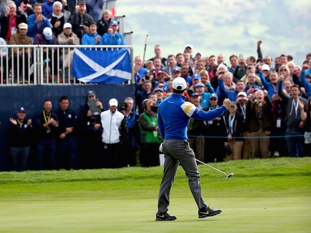 Rory McIlroy of Europe celebrates his putt on the 6th green during the Singles Matches of the 2014 Ryder Cup on the PGA Centenary course at Gleneagles on September 28, 2014