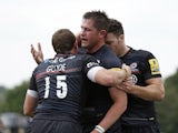 Ernst Joubert of Saracens celebrates scoring a try with Alex Goode during the Aviva Premiership match between Saracens and Sale Sharks at Allianz Park on September 27, 2014