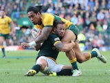 Joe Tomane of the Wallabies is tackled by Francois Hougaard during The Rugby Championship match between the South African Springboks and the Australian Wallabies at Newlands Stadium on September 27, 2014