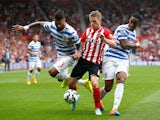 Steven Davis of Southampton vies with Armand Traore and Leroy Fer of QPR during the Barclays Premier League match between Southampton and Queens Park Rangers at St Mary's Stadium on September 27, 2014