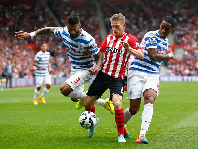 Steven Davis of Southampton vies with Armand Traore and Leroy Fer of QPR during the Barclays Premier League match between Southampton and Queens Park Rangers at St Mary's Stadium on September 27, 2014