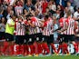 Ryan Bertrand (#21) of Southampton celebrates with his team-mates after scoring the opening goal during the Barclays Premier League match between Southampton and Queens Park Rangers at St Mary's Stadium on September 27, 2014
