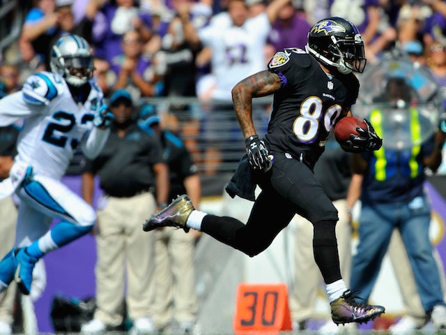 Wide receiver Steve Smith #89 of the Baltimore Ravens scores a touchdown in the second quarter of a game against the Carolina Panthers on September 28, 2014