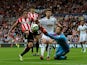  Billy Jones of Sunderland and Lukasz Fabianski of Swansea City battle for the ball during the Barclays Premier League match between Sunderland and Swansea City at Stadium of Light on September 27, 2014