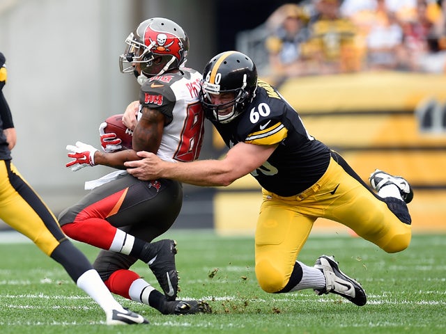 Solomon Patton #86 of the Tampa Bay Buccaneers is tackled by Greg Warren #60 of the Pittsburgh Steelers during the first quarter at Heinz Field on September 28, 2014
