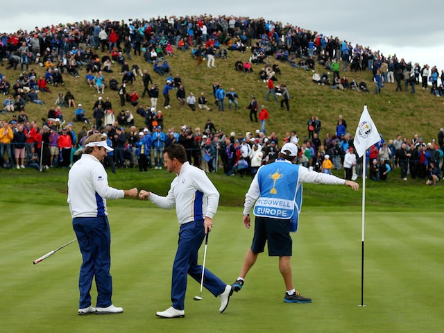 Victor Dubuisson and Graeme McDowell of Europe celebrate on the 3rd green during the Afternoon Foursomes of the 2014 Ryder Cup on the PGA Centenary course at Gleneagles on September 27, 2014