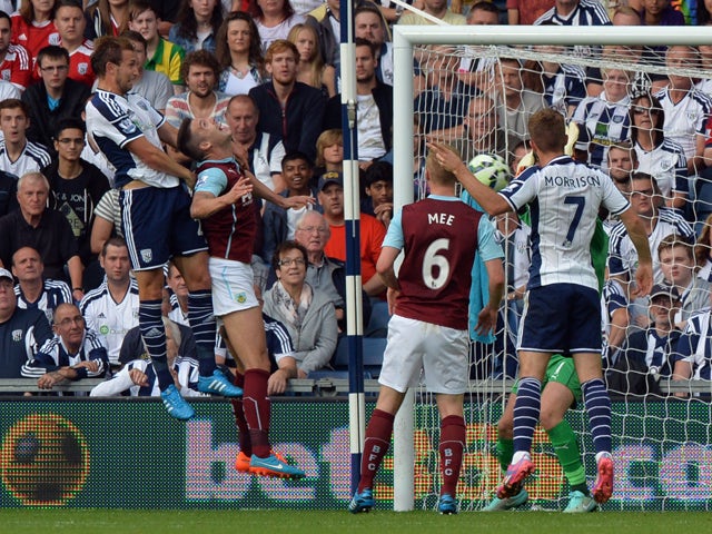 West Bromwich Albion's English defender Craig Dawson scores a goal during the English Premier League football match between West Bromwich Albion and Burnley at the Hawthorns in West Bromwich on September 28, 2014