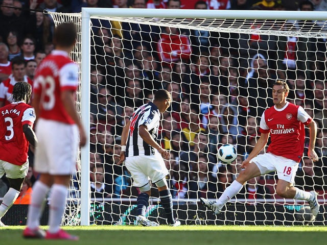 Jerome Thomas of West Bromwich Albion shoots past Laurent Koscielny of Arsenal to score their third goal during the Barclays Premier League match between Arsenal and West Bromwich Albion at the Emirates Stadium on September 25, 2010