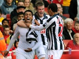 West Bromwich Albion's Chilean defender Gonzalo Jara celebrates scoring with team-mates Northern Irish midfielder Chris Brunt and Nigerian striker Peter Odemwingie during the English Premier League football match between Arsenal and West Bromwich Albion a