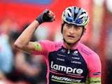 Lampre's Colombian cyclist Winner Anacona celebrates as he crosses the finish line to win the 9th stage of the 69th edition of 'La Vuelta' Tour of Spain, a 185 km ride from Carboneras de Guadazaon to Aramon Valdelinares on August 31, 2014