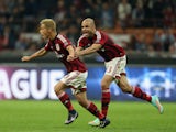 Keisuke Honda of Milan celebrates after scoring the second goal with his team-mate Alex during the Serie A match between AC Milan and AC Chievo Verona at Stadio Giuseppe Meazza on October 4, 2014