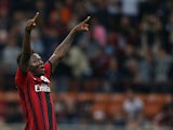 Sulley Muntari of Milan celebrates after scoring his team's opening goal during the Serie A match between AC Milan and AC Chievo Verona at Stadio Giuseppe Meazza on October 4, 2014