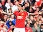 Angel Di Maria of Manchester United celebrates scoring the first goal during the Barclays Premier League match against Everton at Old Trafford on October 5, 2014