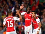 Danny Welbeck of Arsenal celebrates with team-mates Alex Oxlade-Chamberlain and Alexis Sanchez after scoring the opening goal during the UEFA Champions League group D match between Arsenal FC and Galatasaray AS at Emirates Stadium on October 1, 2014