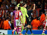 Wojciech Szczesny of Arsenal receives a red card from referee Gianluca Rocchi during the UEFA Champions League group D match between Arsenal FC and Galatasaray AS at Emirates Stadium on October 1, 2014