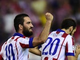 Atletico Madrid's Turkish midfielder Arda Turan celebrates after scoring the first goal during the UEFA Champions League group A football match Atletico de Madrid vs Juventus at the Vicente Calderon stadium in Madrid on October 1, 2014