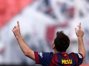 Record-equalling Messi fires Barca ahead